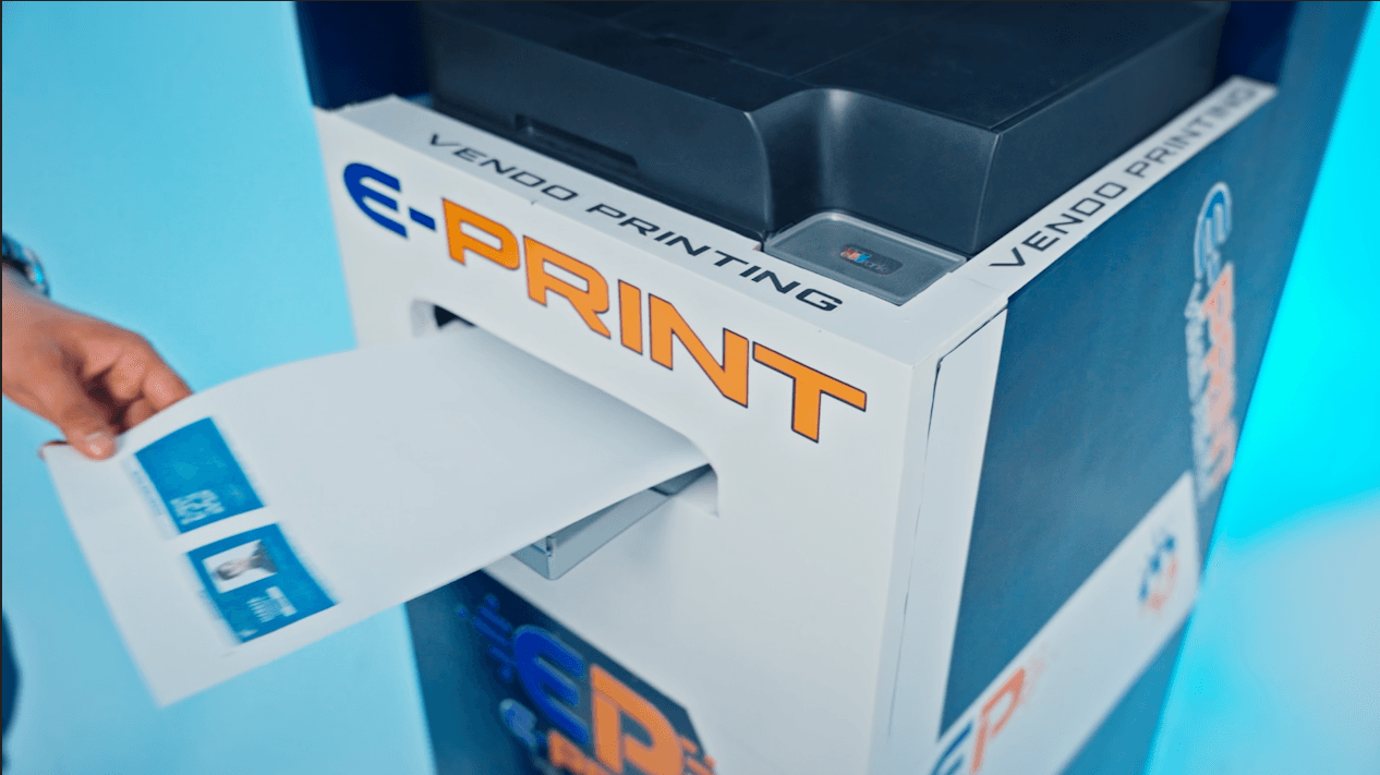 A printout emerging from the E-Print kiosk's output tray